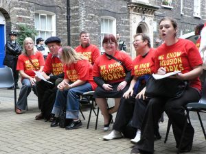 Group of ALLFIE supporters wearing "We Know Inclusion Works" tshirts
