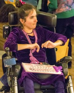 Maresa in her wheelchair at an event