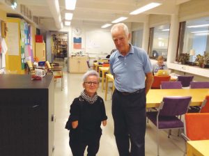 Tara and Martin standing in a classroom