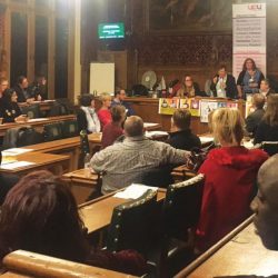 Committee room 10, a wood panelled room, at the House of Commons, full of attendees at the day of action