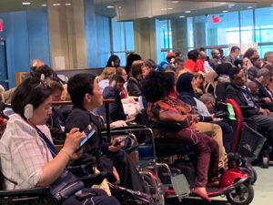 A large group of wheelchair users