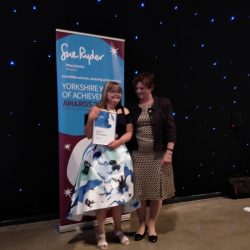 Katie collecting her award