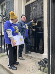 Martine Harding and Simone Aspis knock on the door of 10 Downing Street