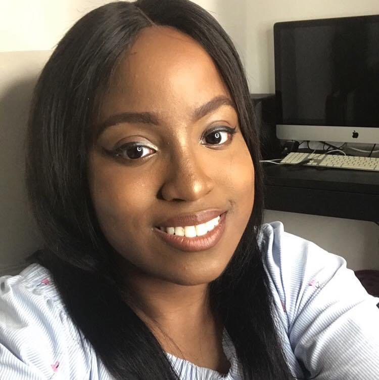 Image: Yewande Akintelu-Omoniyi, head and shoulders shot smiling at the camera